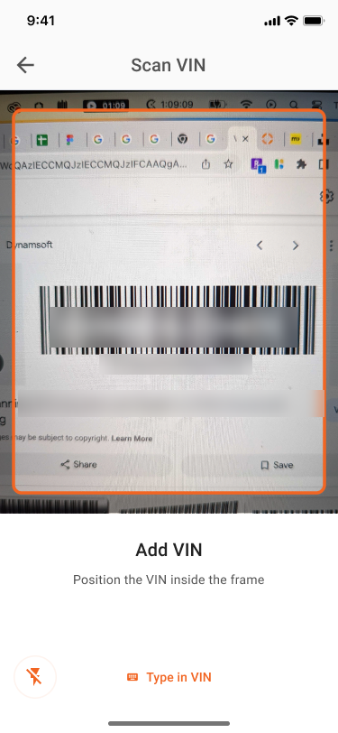 Scan VIN screen with the camera framing a VIN barcode and a Type in VIN option